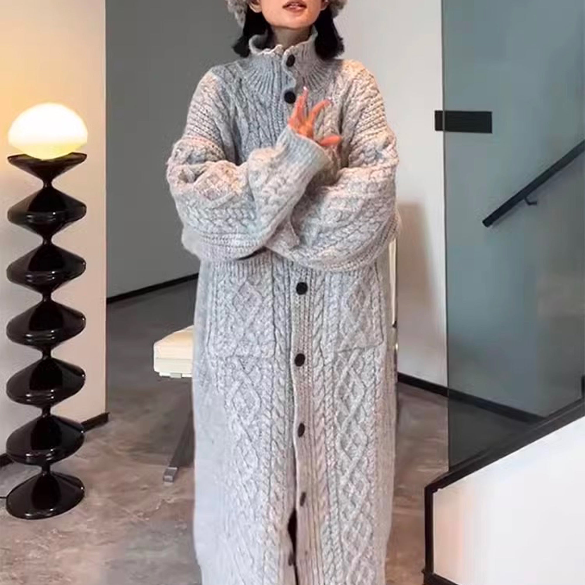 Gray knitted cardigan for women, featuring a high collar and loose fit, perfect for a cozy and stylish look.